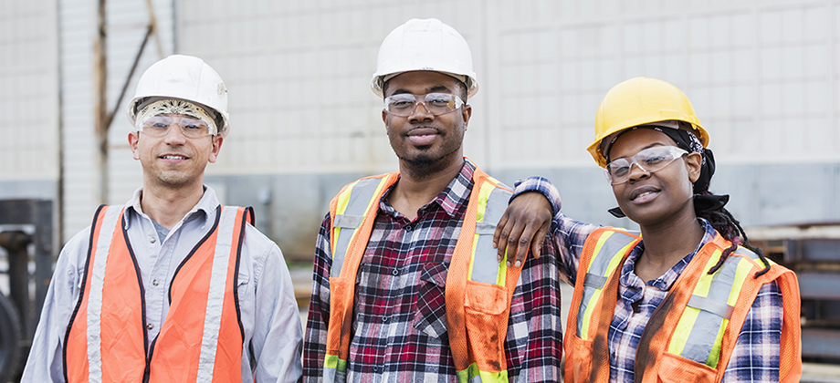 group of construction workers looking into the camera